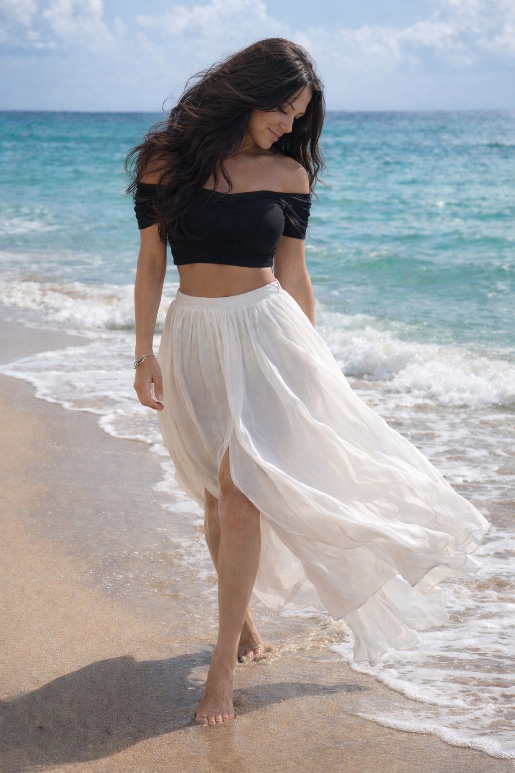 Shari on the beach in a flowing white skirt